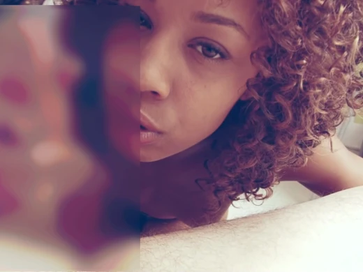 Ebony cutie explores an erect wiener with her tongue and mouth