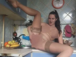 Morning masturbation with banana on the kitchen counter
