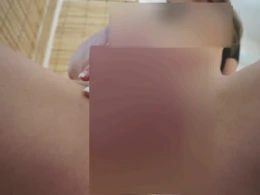 Cutie spreads her pussy lips and sucks on a dildo