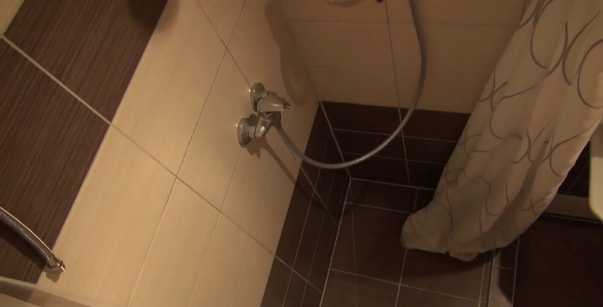 Hidden Camera Shows A Mature Woman Showering Her Luscious Tits
